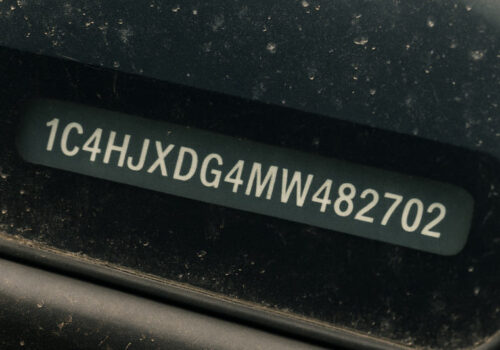 17-digit VIN number at the botom left of a windshield.