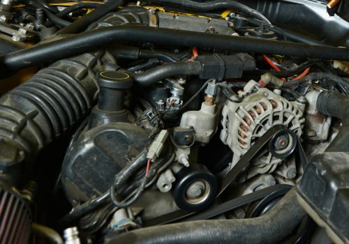 A worn serpentine belt creating problems and emitting a squeaking noise.