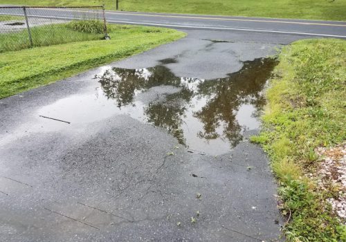 Redirecting water from the driveway.