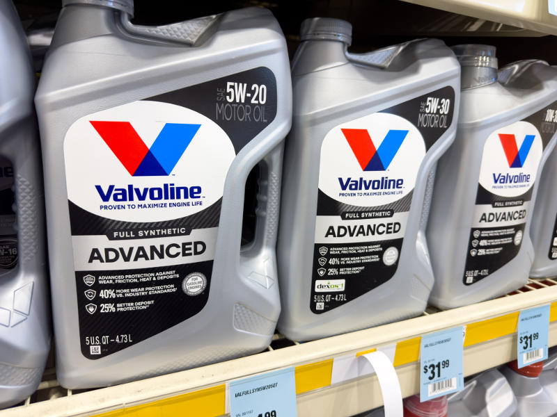 Different full synthetic motor oils on a store shelf.